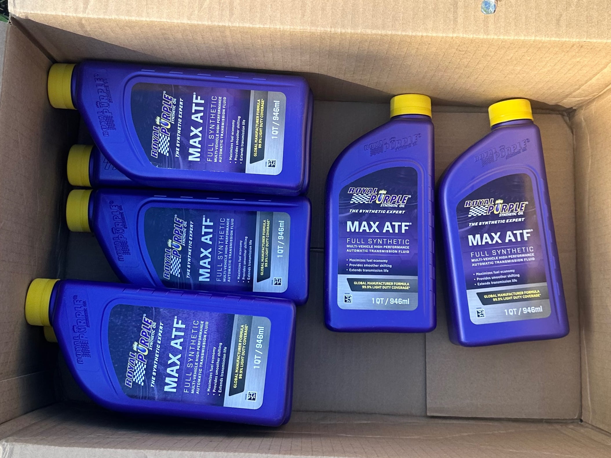 Multiple bottles of Royal Purple Max ATF full synthetic automatic transmission fluid, commonly used for servicing Jeep automatic transmissions.