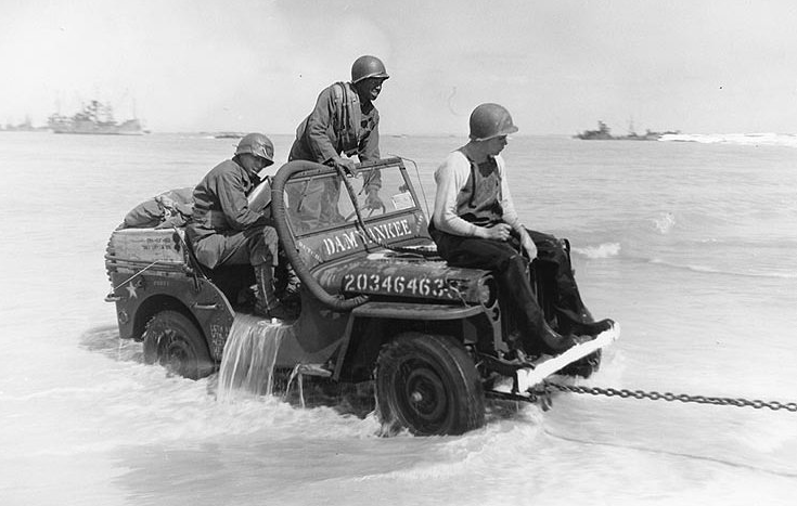 Jeep being towed ashore 1944