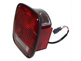 Tail Light; Black Housing; Red/Clear Lens; Driver Side (98-06 Jeep Wrangler)