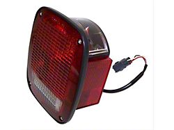 Tail Light; Black Housing; Red/Clear Lens; Driver Side (98-06 Jeep Wrangler)